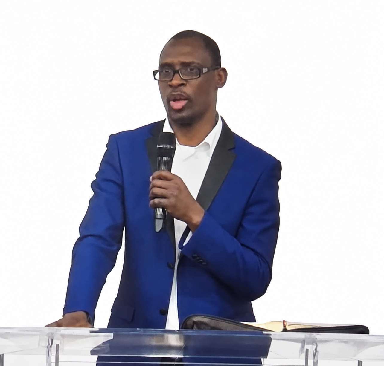 Pastor Tayo Olatunji, Principal Regional Overseer, speaking at the pulpit